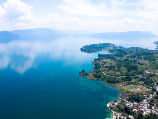 Fototapeta na wymiar The beautiful aerial view of Lake Toba. Lake Toba is one of the tourist destinations in North Sumatra, Indonesia.