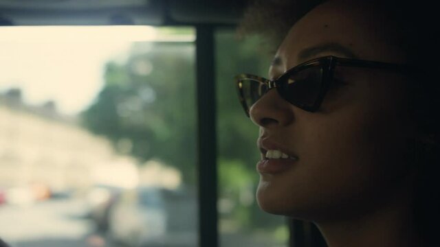 CU Young woman sitting in car and talking / Hackney, London, England, UK