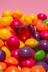 a pile of colorful Skills sweets with a red heart on top