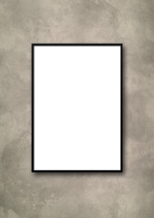 Black picture frame hanging on a light concrete wall