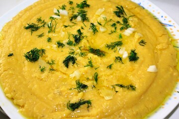Traditional Greek Fava, yellow split pea puree with olive oil, onion and dill.
