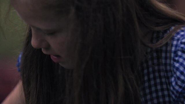 CU TS Girl taking stick with marshmallow / Dinton, Wiltshire, United Kingdom