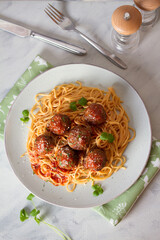Spaghetti pasta with meatballs and tomato sauce. View from above, top view