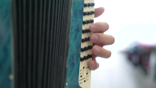 man plays bayan accordion player