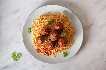 Spaghetti pasta with meatballs and tomato sauce. View from above, top view