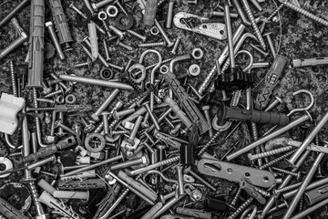 screws and bolts, nails and nuts. Monochrome abstract industrial background for Fathers Day. Assorted metalware flat lay