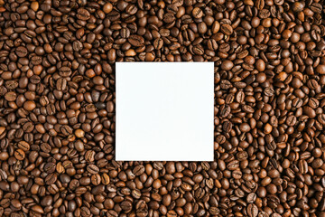 roasted coffee beans with white mock up paper