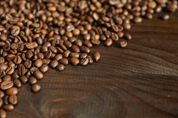 roasted coffee beans on wooden background