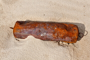 Old rusty detail on sand