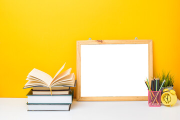 School equipment on yellow background with frame Mockup, Education background concept