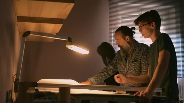 MS LA Family talking at desk / Cameri, Novara, Italy