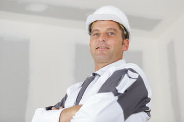 happy builder worker at construction site