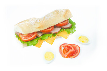 Big tasty sandwich with tomato lettuce with soap and ham on a white background