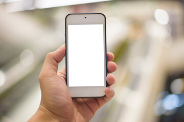 woman hand is holding cell phone mockup on shopping center background