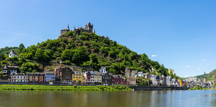 With the bike on the cycle path through the countryside along the river Moselle in Rhineland-Palatinate from Trier to Koblenz in summer