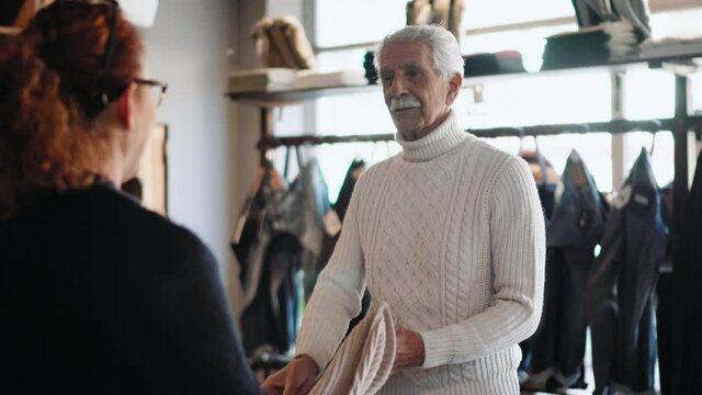 MS SELECTIVE FOCUS Owner Advising Customer In Shop / Rosignano, Livorno, Italy