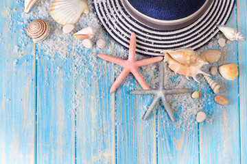 Background of seashells, starfishes and Beach hat