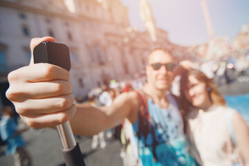 Happy couple lover tourist taking selfie photo on background fountain Four rivers in Piazza Navona, Rome Italy