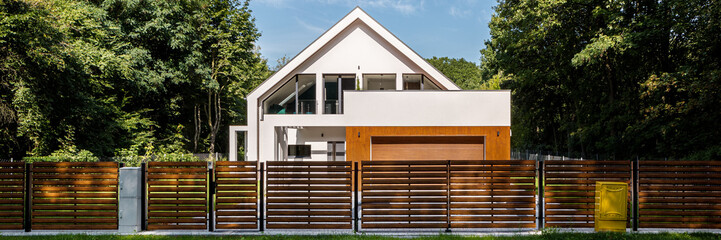 Modern house with fence, panorama