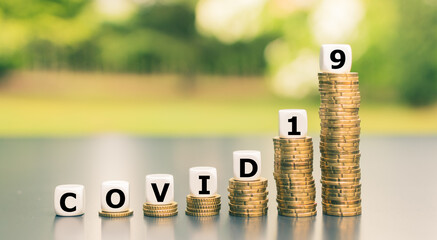 Symbol for increasing expenses due to the corona pandemic. Dice form the expression 