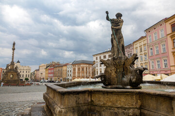 Fototapeta na wymiar The 18th-century Holy Trinity Column with baroque fountain in the tourist downtown of Olomouc, city in the eastern province of Moravia in the Czech Republic.