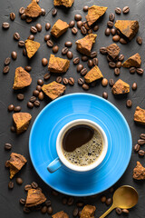 Trendy healthy coffee with chaga mushroom. Dry and fresh mushrooms and coffee beans on a dark background. top view.