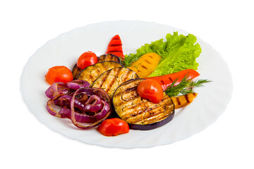 Vegetable salad on white plate with grilled eggplant, cherry tomatoes, red and yellow bell peppers, purple onions, dill, lettuce leaf.