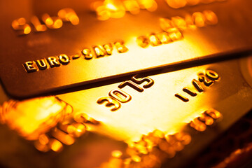 Gold credit card. Macro image