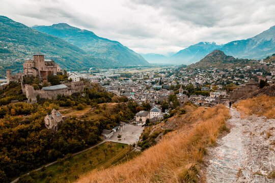 Panorama of Sion city, Rhone Valley and medieval Valere Basilica seen from Tourbillon Castle hill, canton Valais, Switzerland