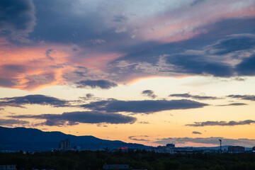Cloudy sunset over the city of Sofia, Bulgaria. Warm colors sunset.