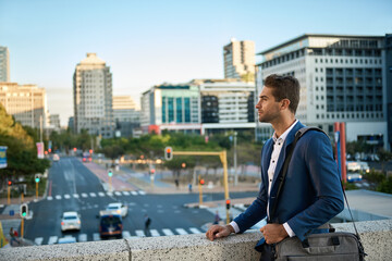 Young businessman walking through the city to work