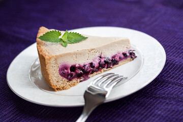 Slice of coffee cake with blueberries on a plate
