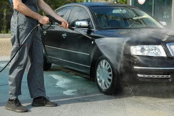 A man washes a car. Clear car concept