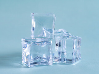 Pile of plastic ice cubes isolated on blue background