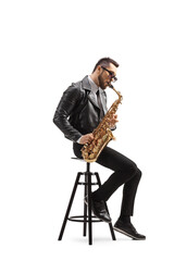 Man in a leather jacket sitting on a chair and playing a saxophone