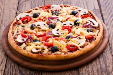 Pizza with seafood on wood table