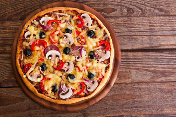 Pizza with seafood on wood table top view