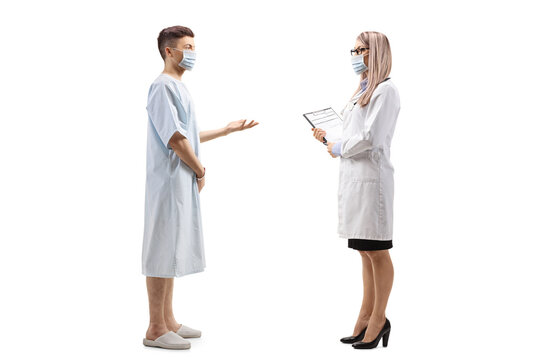 Young Male Patient Talking To A Female Doctor And Wearing Protective Masks