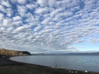 Cloud piles on Lake Bracciano seen from Anguillara Sabazia beach