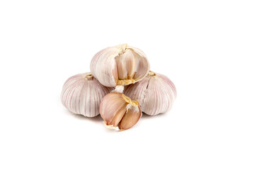 fresh garlic in heads and divided into teeth on a white isolated background