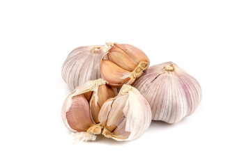 fresh garlic in heads and divided into teeth on a white isolated background