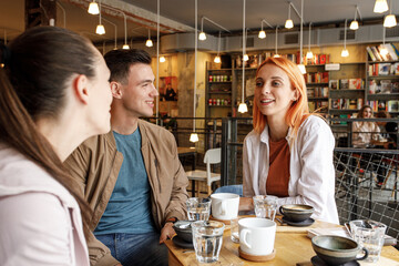 Group of friends hangout  in city cafe  and talking.