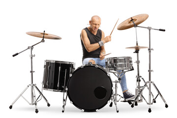 Bald man drummer playing a drum set
