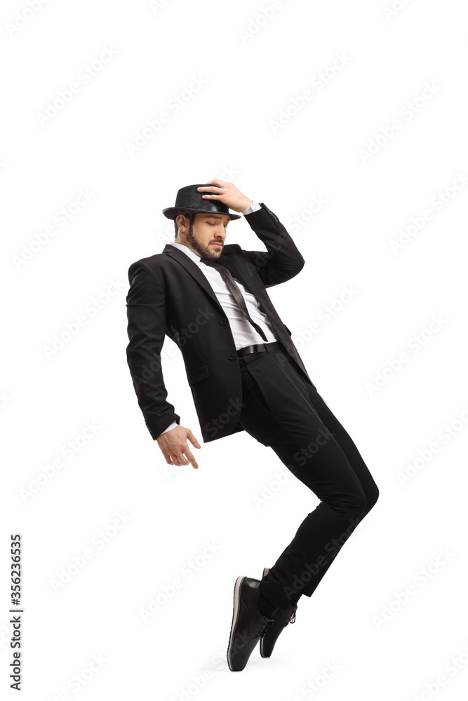 Wall mural Man in a suit and hat dancing on tiptoes