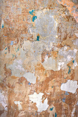 ancient surface of a damaged wall with broken abstract texture - vertical background wallpaper 