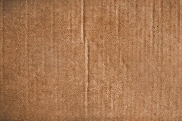 Brown cardboard surface with vertical lines and wrinkles  - board background	