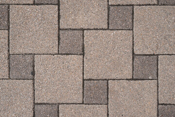Fototapeta premium Stone pavement in perspective. Stone pavement texture. Granite cobblestoned pavement background. Gray brick stone background