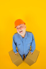 Delivery man with boxes. Happy man holds cardboard box. Bearded man carry boxes. Delivery from shop. Delivery service. Shipment. Delivery concept.