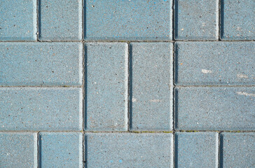 Stone pavement texture. Granite cobblestoned pavement background. Blue brick stone background. Top view
