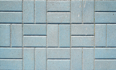 Stone pavement texture. Granite cobblestoned pavement background. Blue brick stone background. Top view